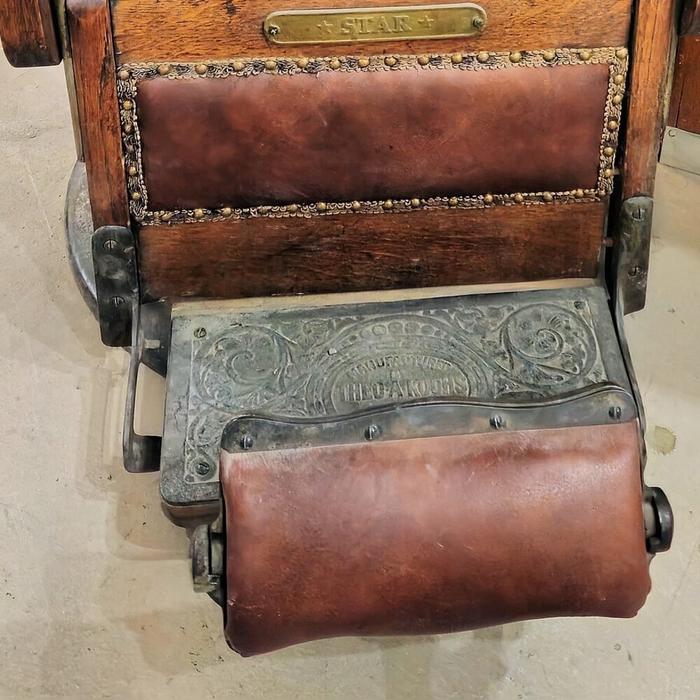 Leather seat and footplate of an antique barber chair
